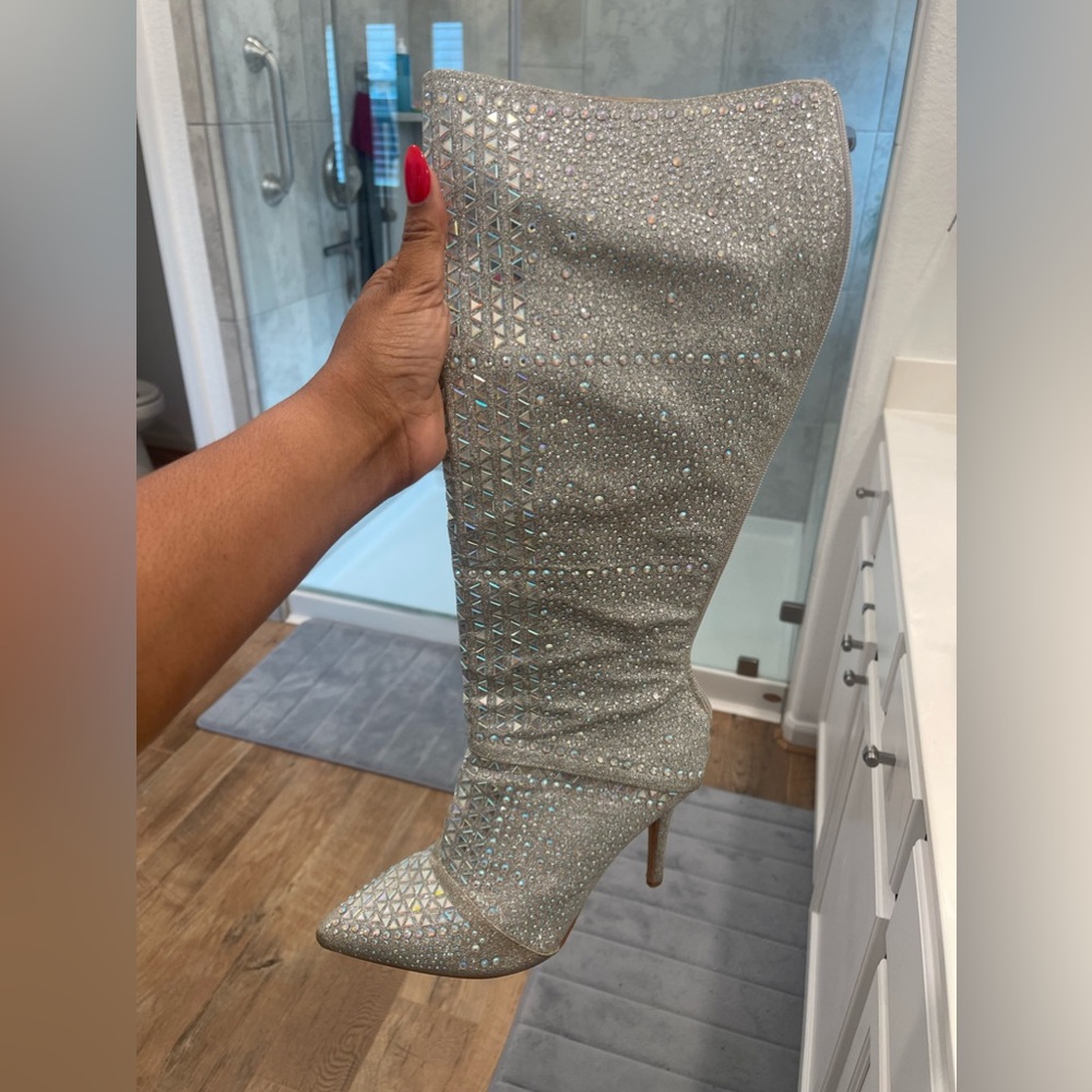 Worn once. Beautiful bedazzled boot! Head turner! Size 9